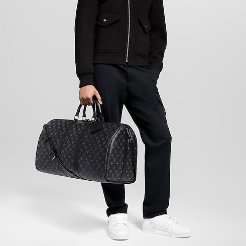 Keepall Bandoulière 55 Monogram Eclipse in Men's Travel All Luggage and Accessories collections by Louis Vuitton (Product zoom)